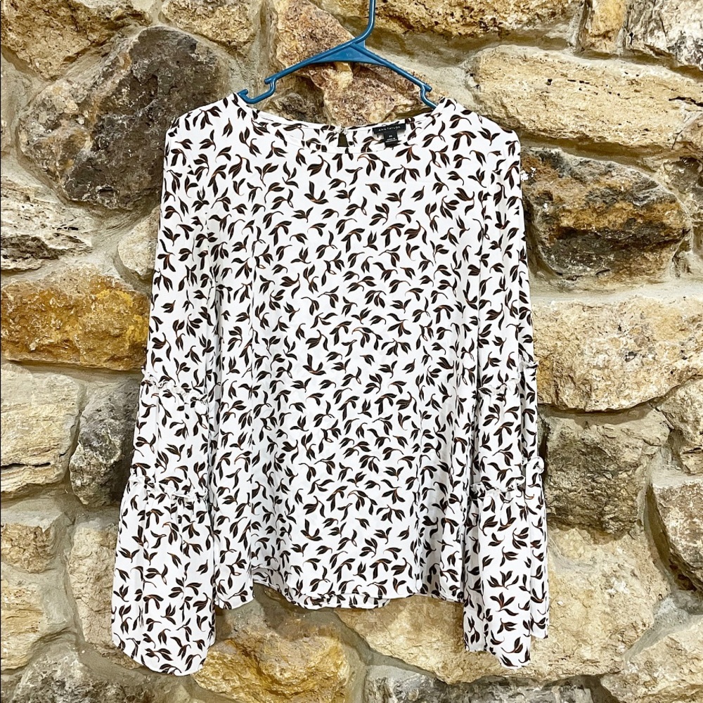 Beautiful blouse. Worn twice. Long ruffle bell sleeves. 100% polyester.